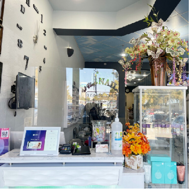 Professional nail technician performing manicure in Rockwall