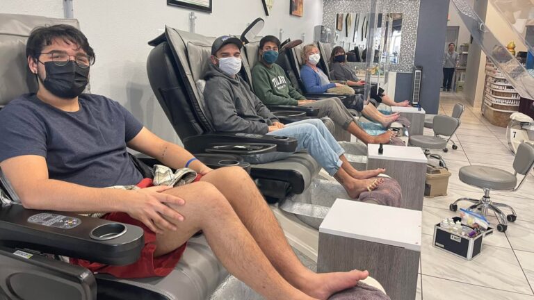 Professional nail technician performing manicure in Rockwall